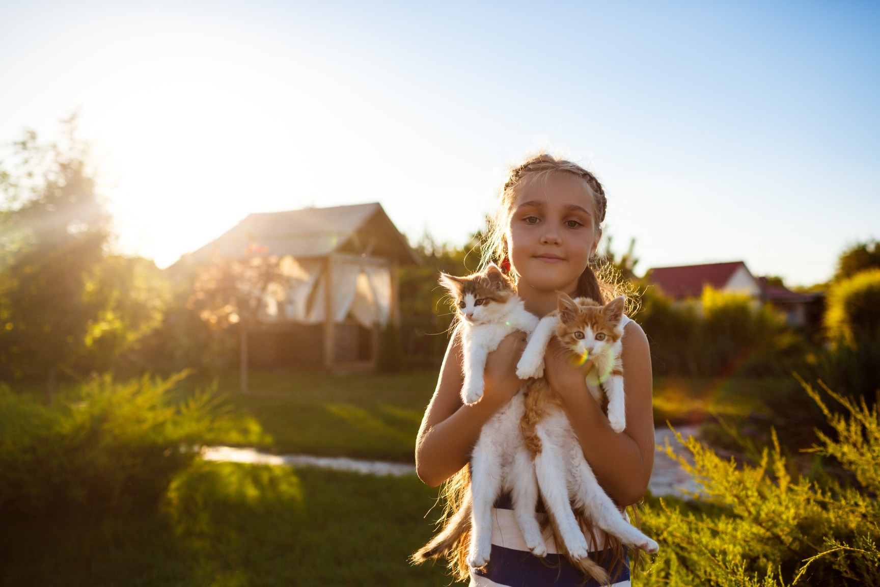 pretty-young-girl-holding-kittens-smiling (1)